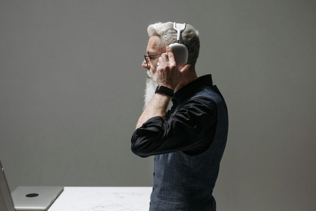 Person enjoying an immersive music experience with high-quality headphones in a relaxed home setting